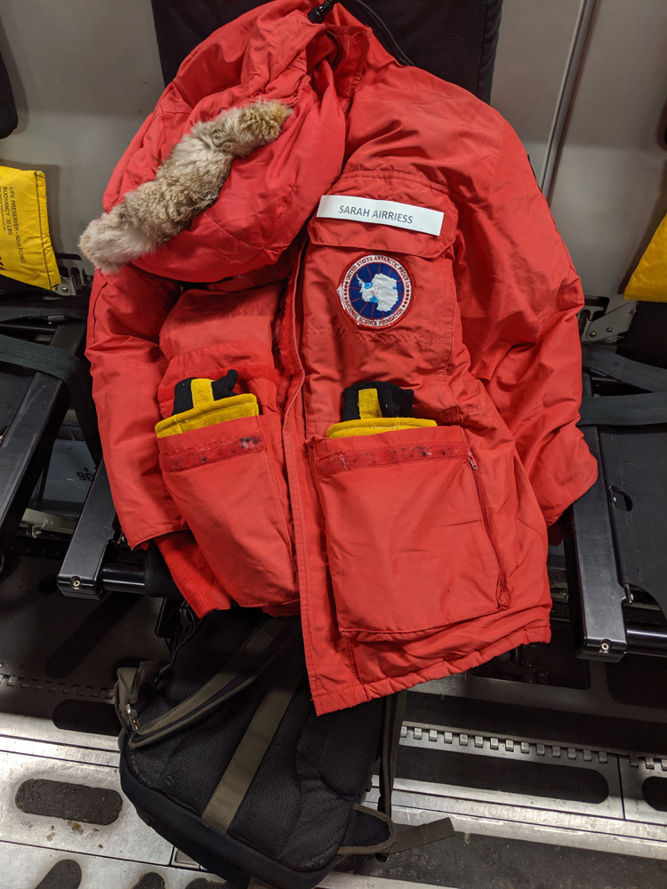 My USAP-issued big red parka, with my name tag on the left breast pocket, heavy duty mittens in the lower pockets.