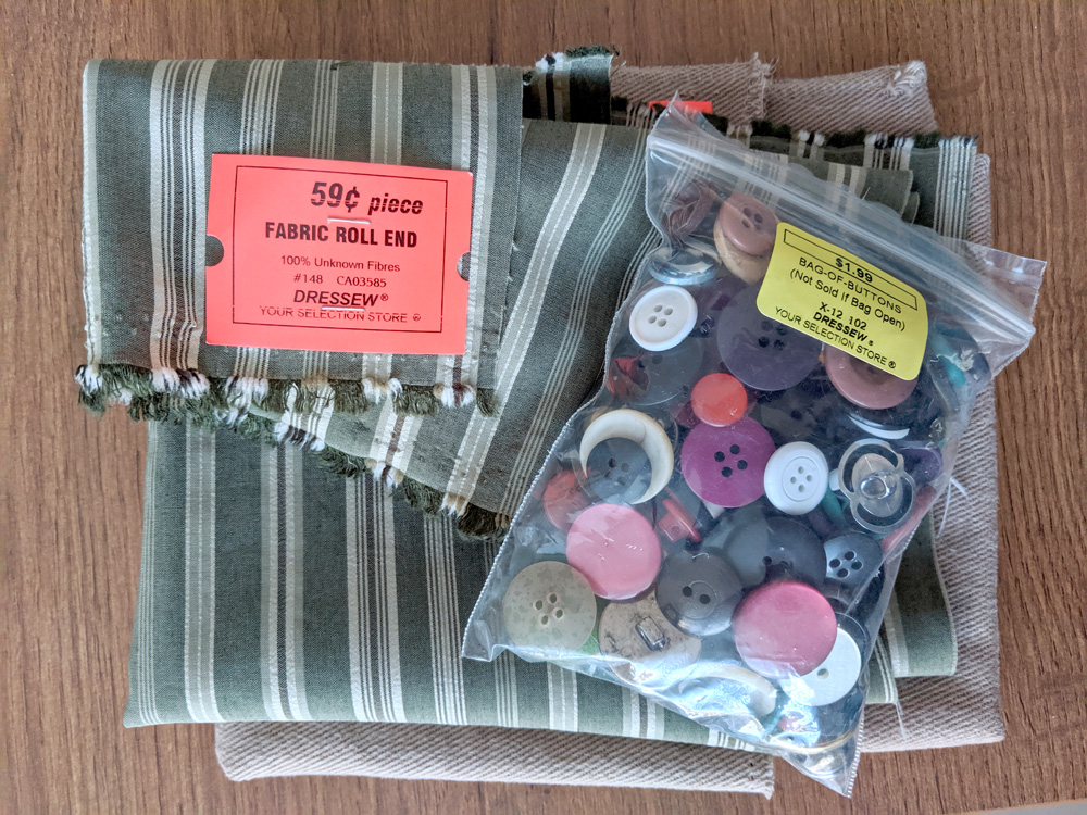 A bag of mixed buttons and some scraps of fabric