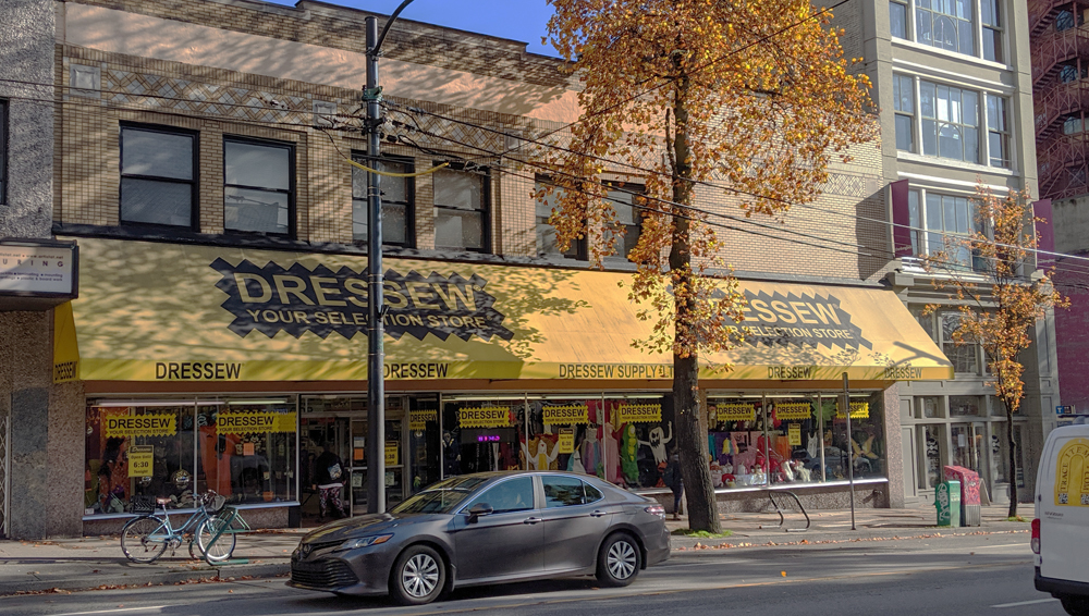 A view of Dressew from across the street, golden in autumnal sunshine.
